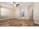 Spacious bedroom with wood-look tile flooring and ceiling fan at 7432 E Melrose St, Mesa, AZ 85207