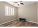 Charming bedroom with wood-look floors and window shutters at 7432 E Melrose St, Mesa, AZ 85207