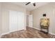 Spacious bedroom with wood-look floors and double doors at 7432 E Melrose St, Mesa, AZ 85207