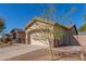 House exterior with a two-car garage and gated entry at 7432 E Melrose St, Mesa, AZ 85207