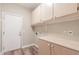 Laundry room with ample cabinet space and hookups at 7432 E Melrose St, Mesa, AZ 85207