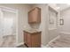 Bright laundry room with built-in cabinets and granite countertop at 7432 E Melrose St, Mesa, AZ 85207