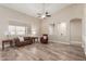 Living room boasts wood-look floors, comfy seating, and recessed lighting at 7432 E Melrose St, Mesa, AZ 85207