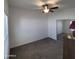 Bright carpeted bedroom featuring a ceiling fan and mirrored closet doors at 7807 E Main St # F36, Mesa, AZ 85207