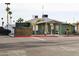 Exterior view of the clubhouse with a sign advertising coffee and donuts every Tuesday at 7807 E Main St # F36, Mesa, AZ 85207