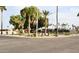 Street view of a community park area with flags, palm trees, and green space at 7807 E Main St # F36, Mesa, AZ 85207