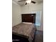 Bedroom with double bed, wooden headboard and window blinds at 7807 E Main St # Ofc, Mesa, AZ 85207