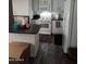 Kitchen island with dark countertop and white cabinets at 7807 E Main St # Ofc, Mesa, AZ 85207