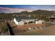 Rear view of the home featuring a large backyard and mountain views at 8169 E Redberry --, Mesa, AZ 85207