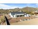 Rear exterior view shows the modern design, private yard, and picturesque mountain backdrop at 8169 E Redberry --, Mesa, AZ 85207