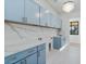 Beautiful Laundry room with sink, quartz countertop, modern chandelier and great cabinets at 8169 E Redberry --, Mesa, AZ 85207