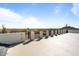 Rooftop deck features desert views, a decorative fence, and a smooth, light-colored surface at 8169 E Redberry --, Mesa, AZ 85207