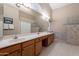 Spacious bathroom with double vanity and large walk-in shower at 8732 W Rockwood Dr, Peoria, AZ 85382