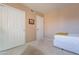 Small bedroom with a twin bed and closet at 8732 W Rockwood Dr, Peoria, AZ 85382