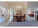 Bright dining room with a wood table and four chairs at 8732 W Rockwood Dr, Peoria, AZ 85382