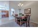 Elegant dining room with a chandelier and wood table at 8732 W Rockwood Dr, Peoria, AZ 85382