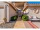 Inviting front entry with decorative door and landscaping at 8732 W Rockwood Dr, Peoria, AZ 85382