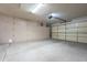 Spacious garage with overhead storage cabinets at 8732 W Rockwood Dr, Peoria, AZ 85382