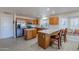 Kitchen with island, stainless steel appliances, and wood cabinets at 8732 W Rockwood Dr, Peoria, AZ 85382