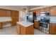 Kitchen with stainless steel appliances and wood cabinets at 8732 W Rockwood Dr, Peoria, AZ 85382