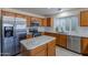 Modern kitchen with stainless steel appliances and an island at 8732 W Rockwood Dr, Peoria, AZ 85382