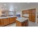 Spacious kitchen featuring an island, ample cabinetry, and stainless steel appliances at 8732 W Rockwood Dr, Peoria, AZ 85382