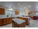 Open concept kitchen with island and stainless steel appliances at 8732 W Rockwood Dr, Peoria, AZ 85382