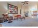 Relaxing living room with leather furniture and a large tapestry at 8732 W Rockwood Dr, Peoria, AZ 85382