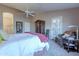 Main bedroom with ensuite bathroom access and seating area at 8732 W Rockwood Dr, Peoria, AZ 85382