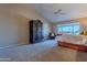 Main bedroom with large windows, golf course view, and walk-in closet at 8732 W Rockwood Dr, Peoria, AZ 85382