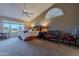 Main bedroom with high ceiling, large windows, and seating area at 8732 W Rockwood Dr, Peoria, AZ 85382