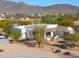 Aerial view of a beautiful home with a large yard and mountain backdrop at 922 E Desert Hills Estate Dr, Phoenix, AZ 85086