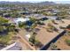 Aerial view of a luxurious house with a pool and expansive backyard, offering stunning mountain views at 922 E Desert Hills Estate Dr, Phoenix, AZ 85086