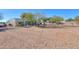 Large backyard with gravel, trees, and a view of the home at 922 E Desert Hills Estate Dr, Phoenix, AZ 85086