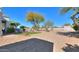 Expansive desert landscape backyard with gravel and trees at 922 E Desert Hills Estate Dr, Phoenix, AZ 85086