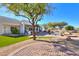 Landscaped backyard with artificial turf and circular patio at 922 E Desert Hills Estate Dr, Phoenix, AZ 85086