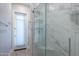 Spa-like bathroom with a walk-in shower and marble tile at 922 E Desert Hills Estate Dr, Phoenix, AZ 85086