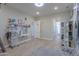 Bright bedroom with built-in desk, shelving, and hardwood floors at 922 E Desert Hills Estate Dr, Phoenix, AZ 85086