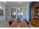 Open concept dining area with views into the living room and kitchen at 922 E Desert Hills Estate Dr, Phoenix, AZ 85086