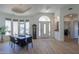 Bright dining room with hardwood floors and large windows at 922 E Desert Hills Estate Dr, Phoenix, AZ 85086