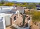 Close-up view of a home's entrance, highlighting the unique architectural details and landscaping at 922 E Desert Hills Estate Dr, Phoenix, AZ 85086