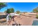 Landscaped backyard with a fire pit and seating area, perfect for entertaining at 922 E Desert Hills Estate Dr, Phoenix, AZ 85086