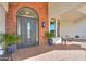 Dark gray front door with arched window and sidelights at 922 E Desert Hills Estate Dr, Phoenix, AZ 85086