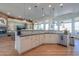 Large kitchen island with sink, ample counter space and copper lighting at 922 E Desert Hills Estate Dr, Phoenix, AZ 85086