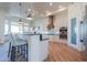 Gourmet kitchen with island seating, copper pendant lights, and white cabinets at 922 E Desert Hills Estate Dr, Phoenix, AZ 85086