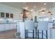 Spacious kitchen featuring white cabinets, copper range hood, and stainless steel appliances at 922 E Desert Hills Estate Dr, Phoenix, AZ 85086