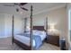 Main bedroom with a large four poster bed and hardwood floors at 922 E Desert Hills Estate Dr, Phoenix, AZ 85086