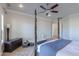 Main bedroom with four-poster bed, hardwood floors, and ceiling fan at 922 E Desert Hills Estate Dr, Phoenix, AZ 85086