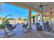 Relaxing covered patio with comfortable seating and pool view at 922 E Desert Hills Estate Dr, Phoenix, AZ 85086