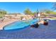 Relaxing kidney-shaped pool with surrounding landscaping at 922 E Desert Hills Estate Dr, Phoenix, AZ 85086